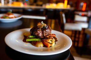 MANZO: Hanger Steak, Allnatural Black Angus Beef, Seasonal Local Vegetables, Rosemary Roasted Potatoes. Photography By Jamie Robbins.