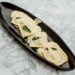 RAVIOLI: House Made Ravioli Filled with Ricotta Cheese and Spinach, Parmigiano, Cream, and Sage Sauce. Photography by Jamie Robbins.
